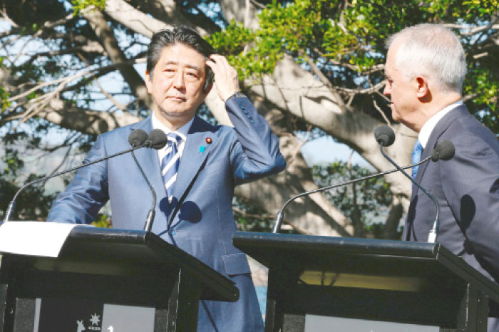 Japanese Prime Minister Shinzo Abe participates in a media conference with Australian Prime Minister Malcolm Turnbull after their bilateral meeting at Kirribilli House in Sydney, Australia, on Saturday. — Reuters