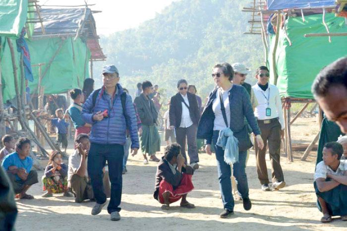 UN special rapporteur on Myanmar, Yanghee Lee, center right in blue jacket, is being escorted during a visit to the Rakhine ethnic Sein Pan Myaing village, near the town of Maungdaw in strife-torn Rakhine State near the Bangladesh border in this file photo. — AFP