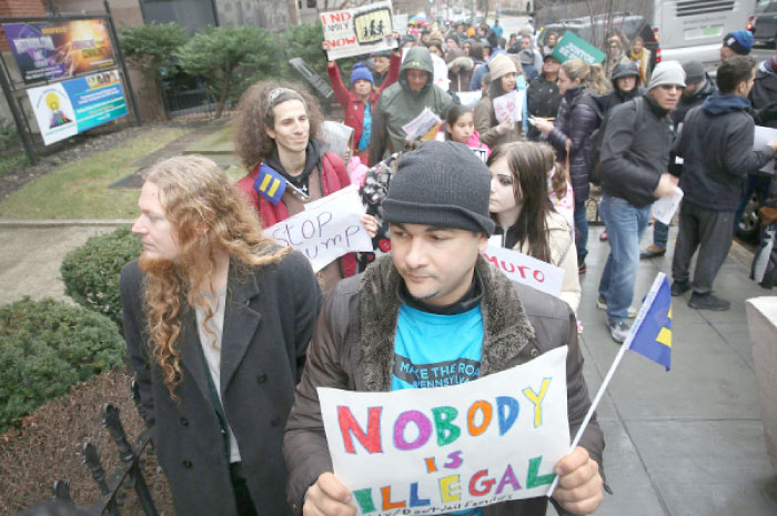 Randy Cepeda joins with other people to rally at the “We›re Here to Stay” immigration event at the Metropolitan AME Church in Washington, D.C, on Saturday. — AFP