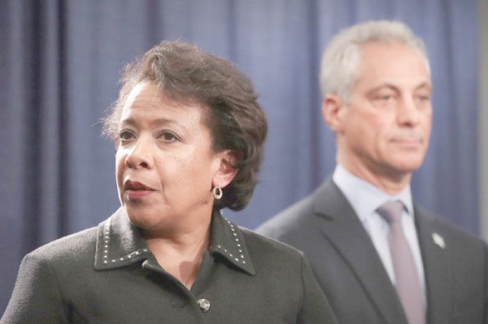 Chicago Mayor Rahm Emanuel, right, and US Attorney General Loretta Lynch take questions at a press conference in Chicago, Illinois, on Friday. — AFP