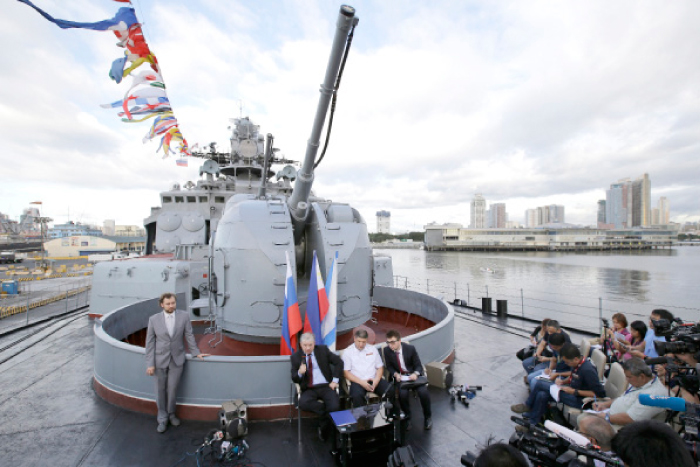 Russia’s Ambassador to the Philippines Igor A. Khovaev, left seated, answers questions from reporters beside Russian Rear Adm. Eduard Mikhailov, Deputy Commander of Flotilla of Pacific Fleet of Russia, during a press conference on board the Russian Navy vessel Admiral Tributs, a large anti-submarine ship, at Manila’s pier on Wednesday. — AP