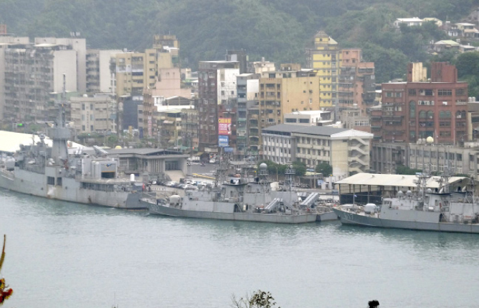 Three Taiwan frigates berth at the Keelung navy base in northern Taiwan on Wednesday. — AFP