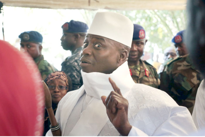 Gambia’s President Yahya Jammeh shows his inked finger before voting in Banjul, Gambia, in this Dec. 1, 2016 file photo. — AP