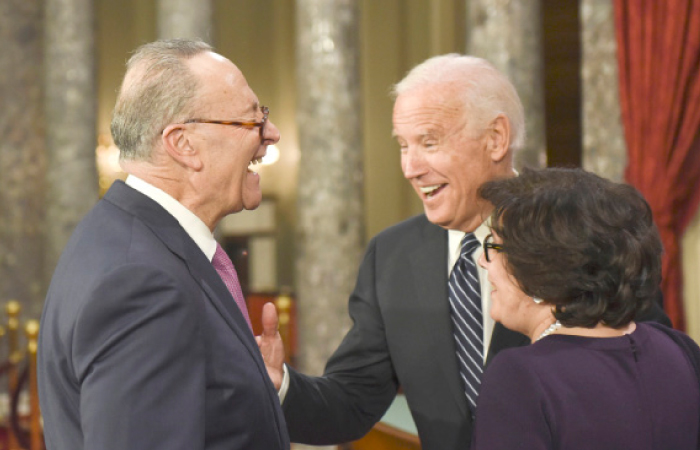 US Vice President Joe Biden shares a laugh with Senate Minority Leader Sen. Charles Schumer of New York, and Iris Weinshall, during a a mock swearing in ceremony in the Old Senate Chamber on Capitol Hill in Washington, on Tuesday. — AP
