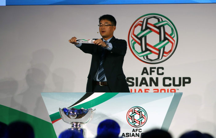 Shin Man Gil, executive director AFC Competitions Division, draws Palestine during the AFC Asian Cup UAE 2019 qualifiers final round draw in Abu Dhabi Monday. - AFP