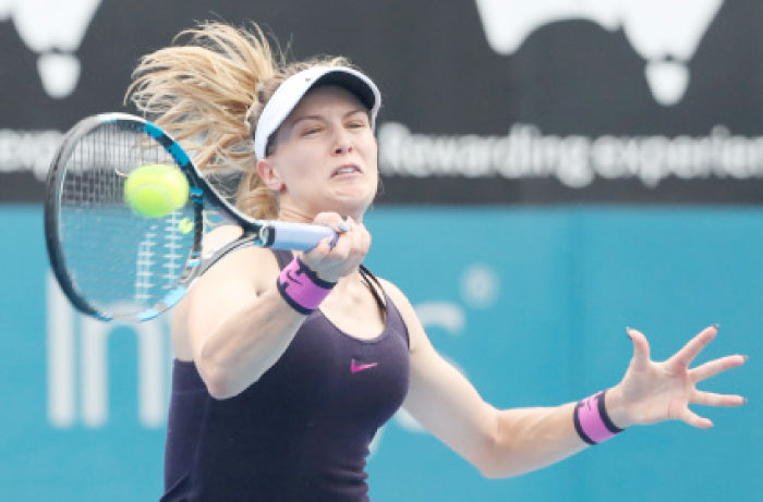 Eugenie Bouchard hits a return to Anastasia Pavlyuchenkova in their quarterfinal match at the Sydney International Tennis Tournament Wednesday. — AFP