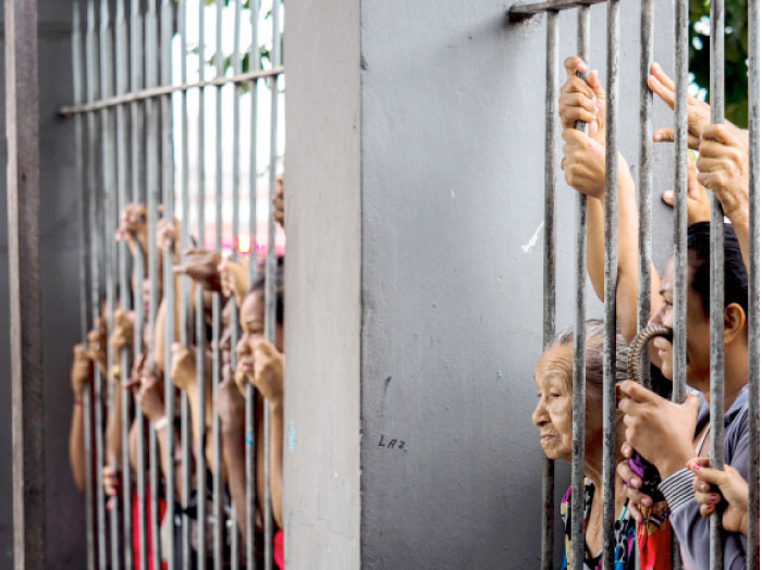Relatives wait for information following a riot that ended with at least four prisoners killed inside Desembargador Raimundo Vidal Pessoa Public Jail in Manaus, Amazonas, Brazil, on Sunday. — AFP