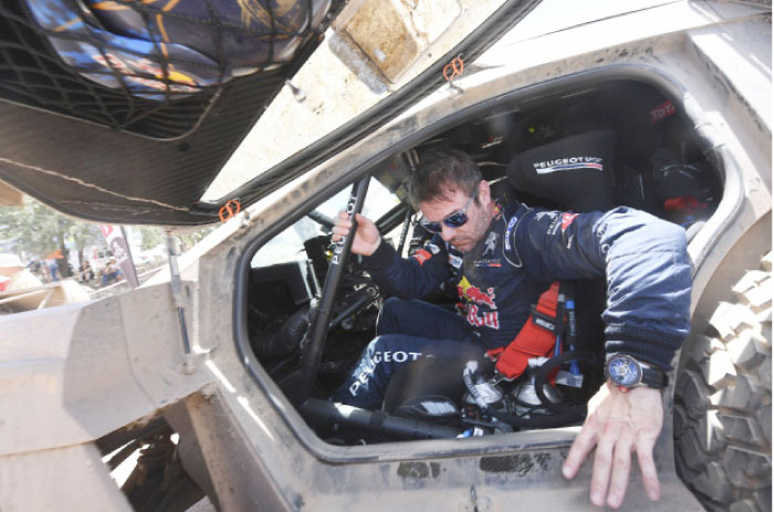 Peugeot’s French driver Sebastien Loeb leaves his car at the end of the Stage 2 of the 2017 Dakar Rally between Resistencia and San Miguel de Tucuman in Tucuman, Argentina, Tuesday. – AFP