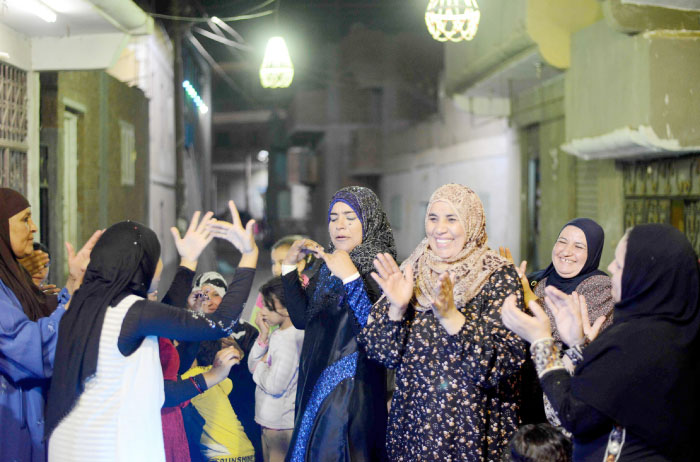 Egyptian women attend a wedding in the Egyptian Nile Delta province of El-Minufiyah on May 17, 2016. — AFP