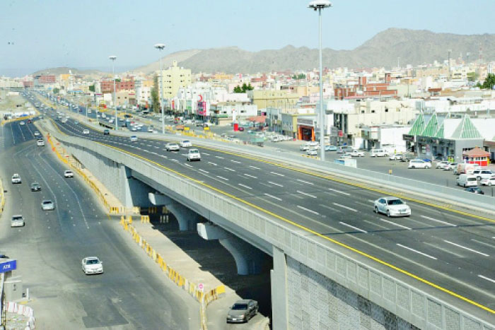 The work on this bridge in Al-Nawariya, Makkah, stopped years ago due to a technical fault, blocking passage below and cutting off residents on either side of the road. — Okaz photo