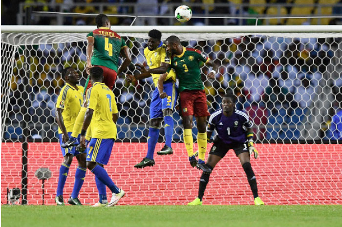 Gabon’s defender Bruno Ecuele Manga (L) heads the ball with Cameroon’s defender Nicolas Nkoulou as Gabon’s goalkeeper Didier Ovono (back) prepares to block the shot during the 2017 Africa Cup of Nations Group A match at the Stade de l’Amitie Sino-Gabonaise in Libreville Sunday. - AFP