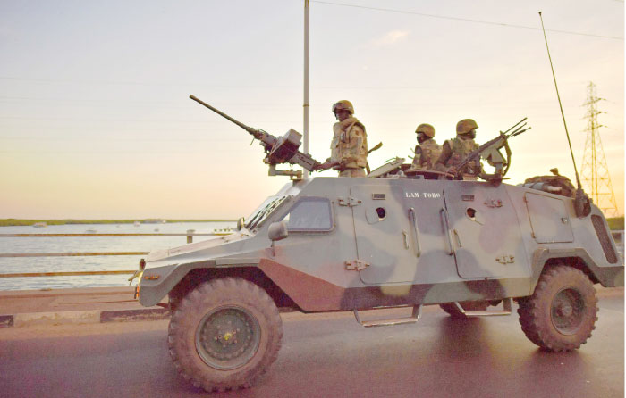 Senegalese soldiers members of ECOWAS forces (Economic Community of West African States) arrive in Banjul as they drive to secure the Statehouse on Sunday. — AFP