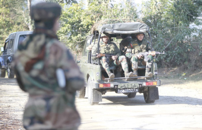 Indian  army soldier patrols during a search operation outside the camp of the General Engineering Reserve Force (GREF), the site of a militant attack, in the frontier Battal area, about 90 km from Jammu, India, on Monday. — AP