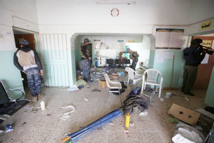 Iraqi Federal Police inspect a hospital used by Daesh militants in the district of Yarimja in southern Mosul. — Reuters