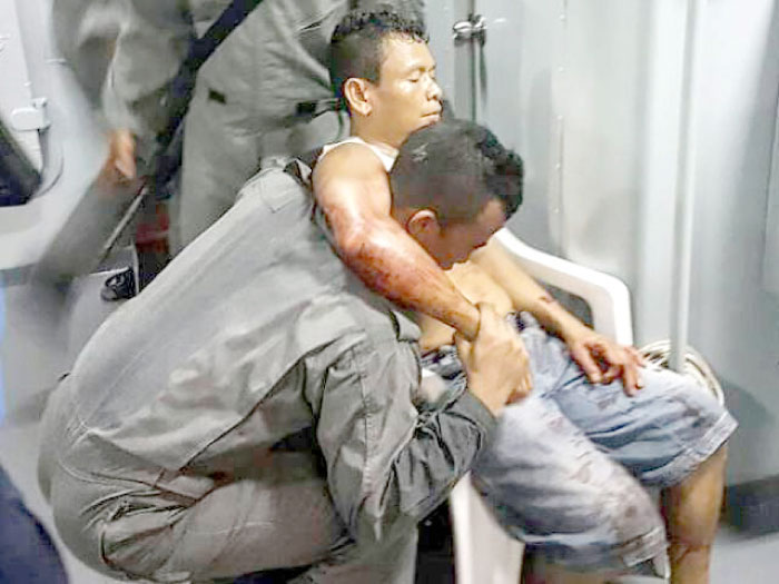 A member of Malaysian Maritime Enforcement Force rescues an Indonesian sailor after being shot during a kidnapping at the east coast of Malaysia’s Sabah state in Lahad Datu in this file photo. — AFP
