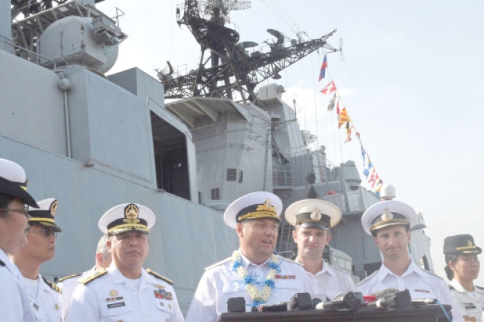 Rear Admiral Eduard Mikhailov, center, deputy commander of the Russian Navy’s Pacific fleet, speaks during a press briefing with Philippine Navy officers following the arrival of the Admiral Tributs anti-submarine ship to Manila on Tuesday. — AFP