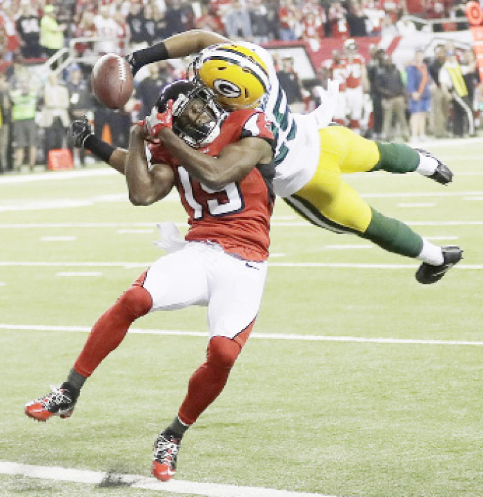 Green Bay Packers’ Marwin Evans breaks up a pass intended for Atlanta Falcons’ Aldrick Robinson during the first half of their NFC championship game in Atlanta Sunday. - AP