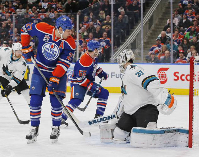 San Jose Sharks goaltender Martin Jones (31) makes a save on Edmonton Oilers forward Milan Lucic (27) during the first period at Rogers Place Tuesday. — Reuters