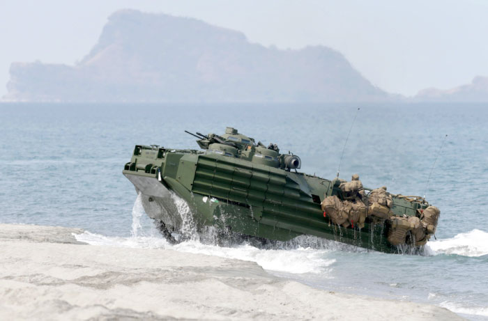 A US Navy’s amphibious assault vehicle with Philippine and U.S. troops on board storms the beach at a combined assault exercise at a beach facing one of the contested islands in the South China Sea in this April 21, 2015 file photo. — AP