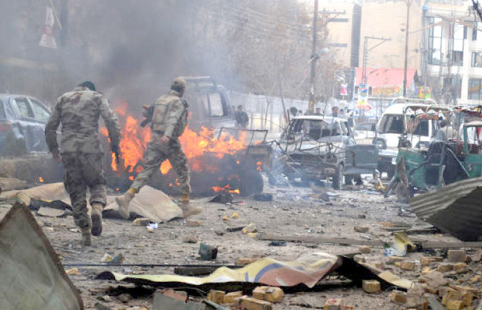 Soldiers of the Pakistani paramilitary force visit the site of a bombing in Quetta, Pakistan, in this March 14, 2014 file photo. — AP