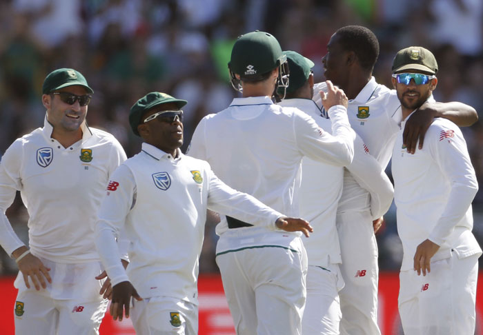 South African team members celebrate as they take the wicket of Sri Lanka Dinesh Chandimal during their 2nd Test match in Cape Town, South Africa, Tuesday. - AP