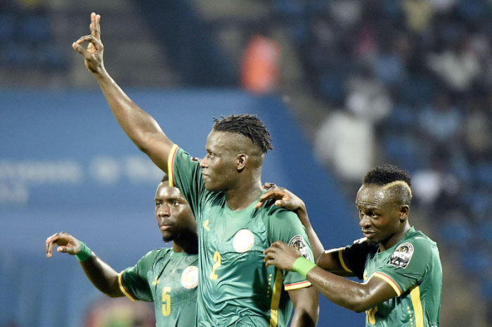 Senegal’s defender Kara Mbodji (C) celebrates with teammates midfielder Idrissa Gana Gueye (L) and forward Sadio Mane (R) after scoring a goal during their 2017 Africa Cup of Nations match against Tunisia in Franceville Sunday. - AFP