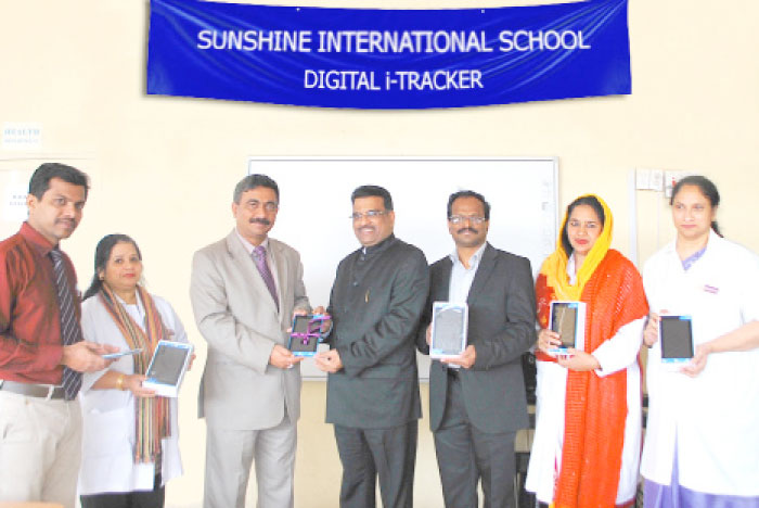 Tablets being distributed to staff members during the KLearn Sunshine Digital iTracker launch ceremony at Sunshine International School, Dammam.