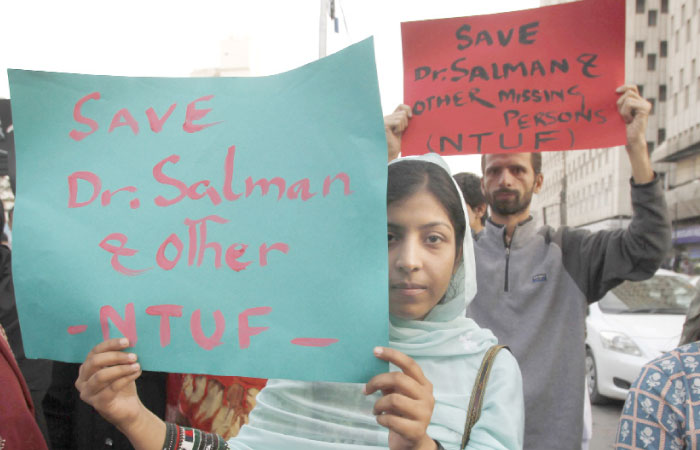 Activists of Pakistan civil society rally to condemn the missing human rights activist Salman Haider, in Karachi, Pakistan, on Monday. — AP