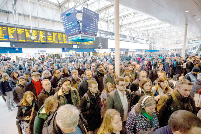 Commuters walk through London Waterloo station in London after strike action by Southern Rail caused another morning of travel disruption in London on Tuesday. — AFP