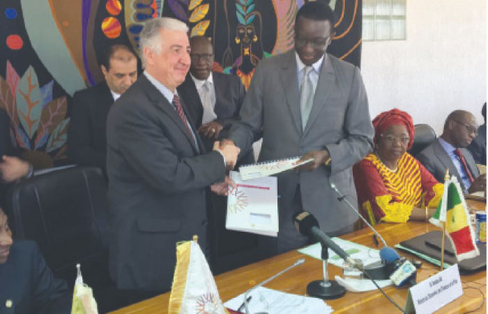 Eng. Hani Salem Sonbol (left), CEO, ITFC exchanges documents during the signing of agreement