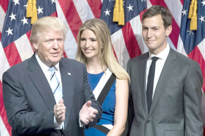 US President-elect Donald Trump, left, his daughter Ivanka Trump, center, and her husband Jared Kushner stand on stage at the end of an event at the Hilton Midtown Hotel in New York City in this July 16, 2016 file photo. — AFP