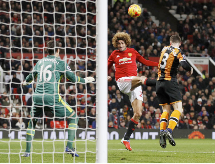 Manchester United’s Marouane Fellaini (C) scores their second goal against Hull City during the EFL Cup semifinal first leg match at Old Trafford Tuesday. — Reuters