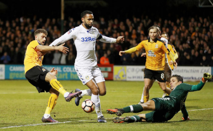 Cambridge United’s Ben Williamson has a shot saved by Leeds’ Marco Silvestri during their FA Cup match at Cambs Glass Stadium Monday. - Reuters