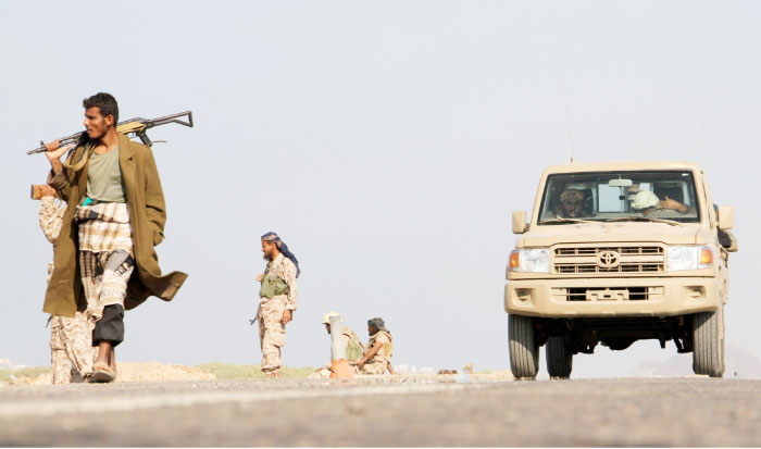 Yemeni pro-government forces patrol western Dhubab district, about 30 kms north of the strategic Bab Al-Mandab Strait. — AFP
