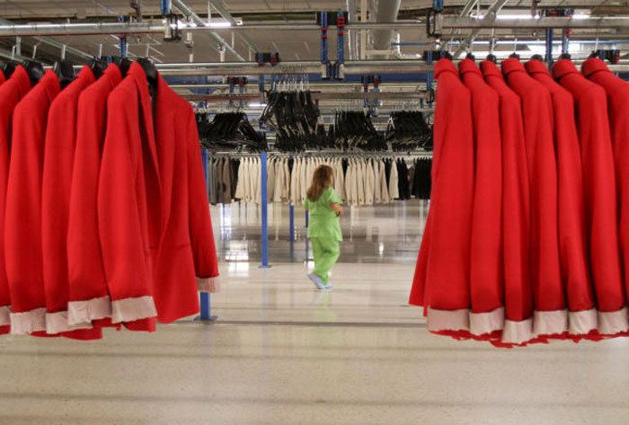 A woman works at the Zara factory at the headquarters of Inditex group in Arteixo, northern Spain, in this June 14, 2012 file photo. — Reuters