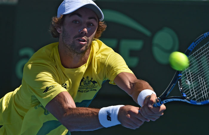 Jordan Thompson of Australia hits a return against Jiri Vesely of the Czech Republic during their Davis Cup match at Kooyong in Melbourne Friday. — AFP