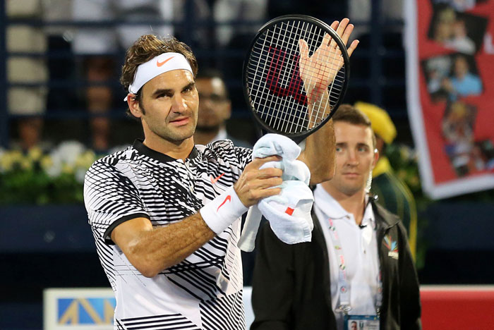 Roger Federer of Switzerland celebrates after winning against France's Benoit Paire at the end of their ATP tennis match during the Dubai Duty Free Championships on Monday. — AFP