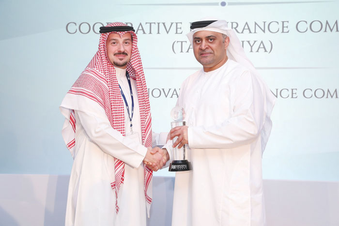 Majed Al-Bahiti, Marketing General Manager of Tawuniya, receives the trophy