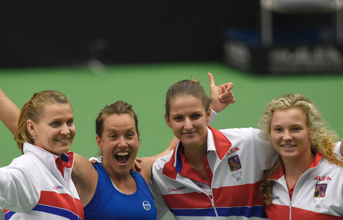 Members of the Czech Fed Cup team (L-R) Lucie Safarova, Barbora Strycova, Karolina Pliskova and Katerina Siniakova celebrate after defeating Spain at the Fed Cup match in Ostrava Sunday. — AFP