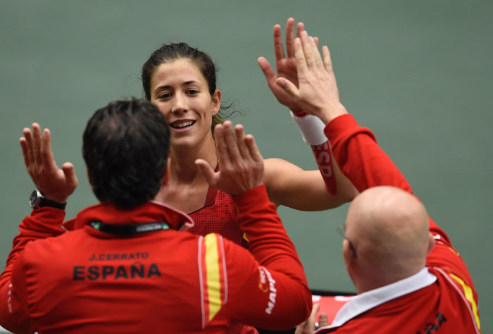 Garbine Muguruza of Spain celebrates with members of Spanish Fed Cup team after beating Barbora Strycova in the Fed Cup match in Ostrava Saturday. — AFP