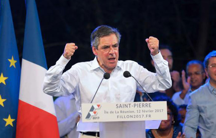 French presidential election candidate for the right-wing Les Republicains (LR) party Francois Fillon gestures as he speaks during a meeting in Saint-Pierre on the French Indian Ocean island of La Reunion on Sunday. — AFP