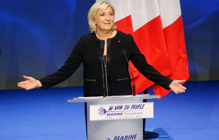 Far-right leader presidential candidate Marine Le Pen gestures as she speaks during a conference in Lyon, France, Sunday. — AP