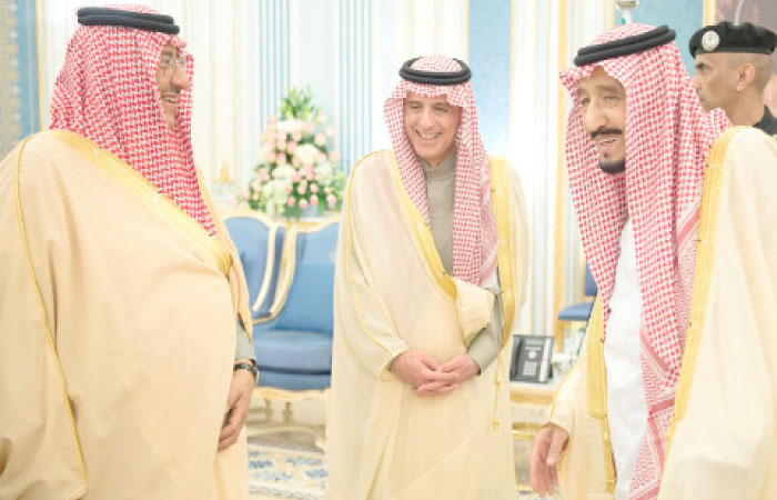 Custodian of the Two Holy Mosques King Salman; Crown Prince Muhammad Bin Naif, deputy premier and minister of interior; and Minister of Foreign Affairs Adel Al-Jubeir share a light moment during a reception at Al-Yamama Palace in Riyadh on Sunday. — SPA