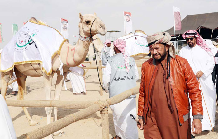 Sheikh Sultan Bin Zayed Al-Nahayan inspects camels during the festival held at the Shweihan racecourse, in Al-Ain on the outskirts of Abu Dhabi.