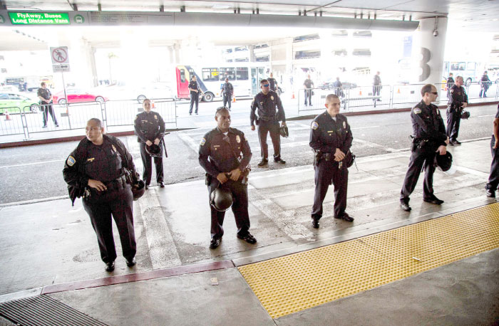 Los Angeles Airport police stand guard at Los Angeles International Airport in Los Angeles, California. — AFP