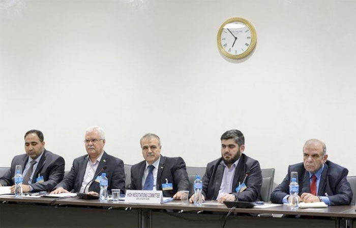 Members of the Syrian opposition delegation of the High Negotiations Committee (HNC) George Sabra (2nd L) delegation head Asaad Al-Zoubi (C) and Chief negotiator, Army of Islam rebel group's Mohammed Alloush (2nd R) attend a meeting with U.N. mediator on Syria Staffan de. — Reuters