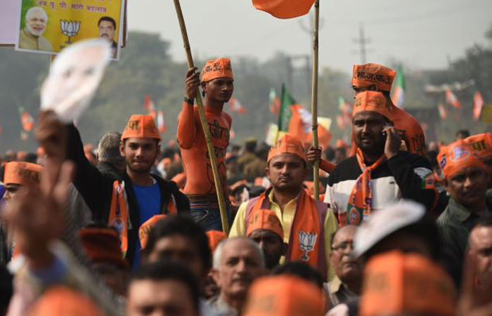 Indian supporters of the Bharatiya Janata Party (BJP) listen to the party leader and Indian Prime Minister Narendra Modi as he speaks during a state assembly election rally in Ghaziabad, Uttar Pradesh, in this Feb. 8, 2017 file photo. — AFP
