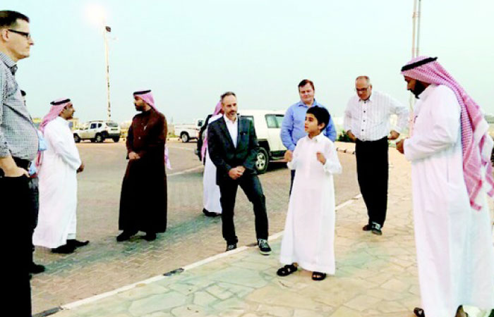 Waleed Al-Limailim shows a group of tourists around the historic places of Qassim. — Courtesy Al-Riyadh