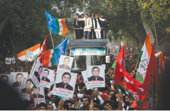 Uttar Pradesh Chief Minister Akhilesh Yadav (top right) and Congress party vice president Rahul Gandhi, wave to the crowd as they stand on a vehicle moving past supporters during their joint election campaign in Agra. At 1.3 billion people, India is the world’s largest and arguably the most chaotic democracy. Elections are a complicated logistical exercise that blends colorful pageantry with more serious political issues. — AP