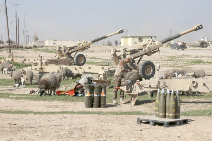 An Iraqi soldier prepare artillery at Iraqi Army base during fighting between Iraqi security forces and Daesh militants on the western side of Mosul. — AP